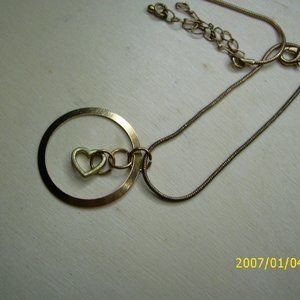 Golden Hoop Necklace With Dangling Golden Heart